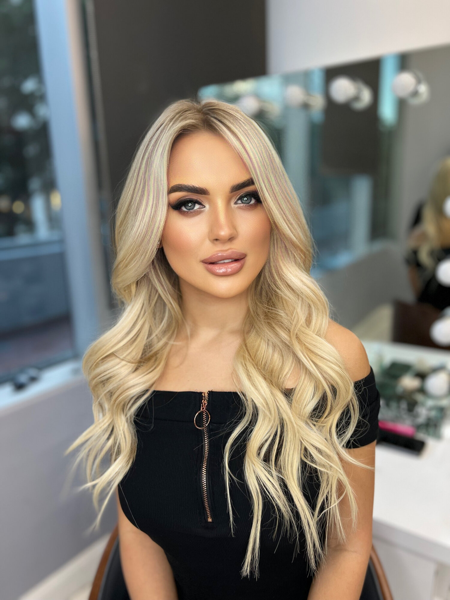 Status Hair client with long, voluminous brunette hair extensions