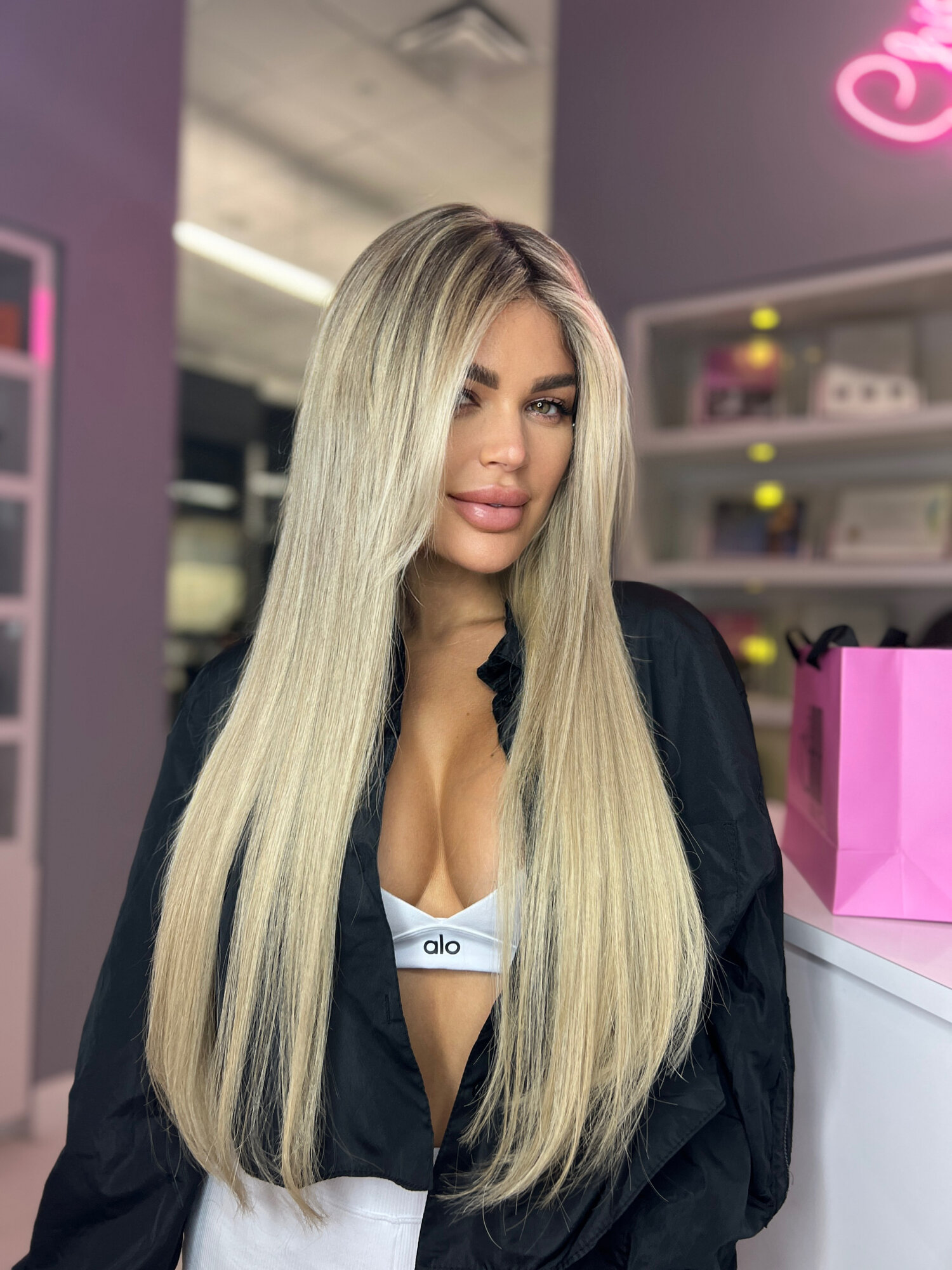 Status Hair client with face-framing layers and extensions